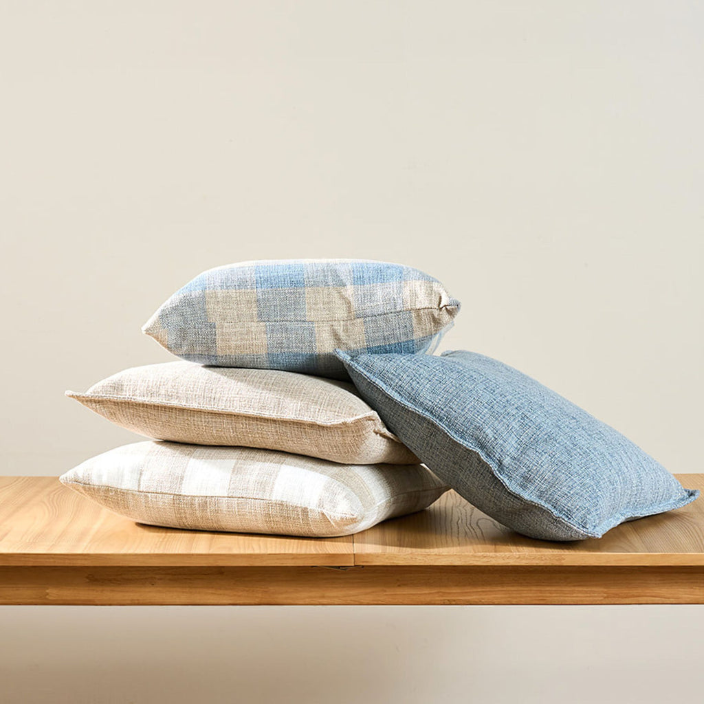 natural-linen-cushions-staked-on-a-oak-table